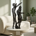 Sculpture Gémeaux noire dans un salon sauge